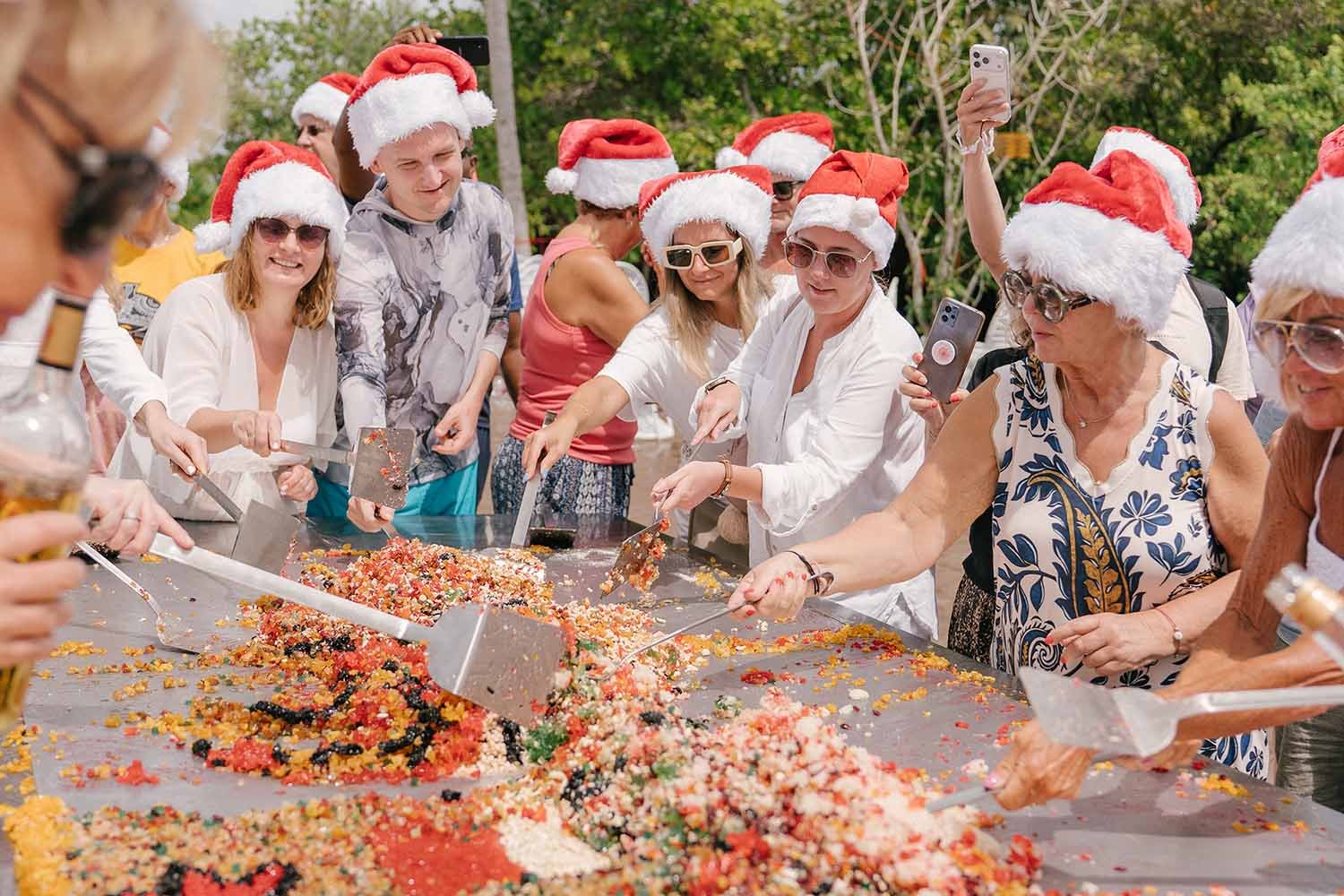 Guests mixing cake ingredients at Canareef Resort Maldives